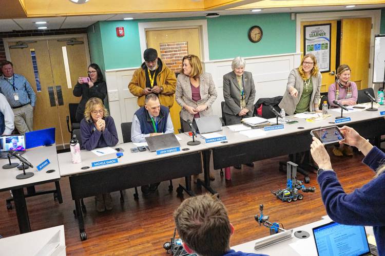 Members of the robotics club at Rundlett Middle School demonstrated their creations to the school board at the outset of its meeting Monday night. The group meets after school and worked to build their robots and code them to complete specific tasks. The club is run through the district's 21st Century Community Learning Centers afterschool program. 
