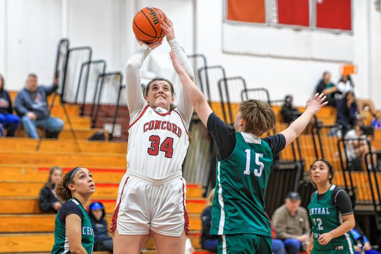Concord’s Sofia Payne (34) goes up for a shot while being tightly marked by Manchester Central-West on Monday at Concord High School. Payne scored 20 points and grabbed 10 rebounds to lead Concord to its fourth straight victory. Concord’s Sofia Payne (34) goes up for a shot while being tightly marked by Manchester Central-West on Monday at Concord High School. Payne scored 20 points and grabbed 10 rebounds to lead Concord to its fourth straight victory.