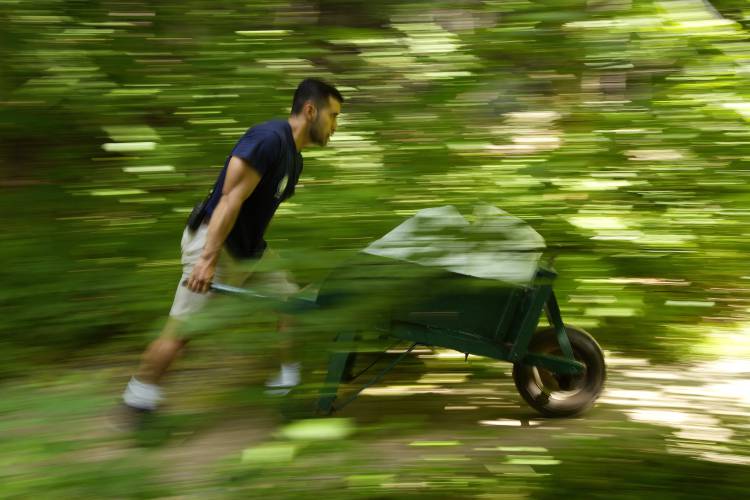FAR LEFT: Javier Rodriguez rushes to deliver ice to guest cabins on the hottest day of the season.