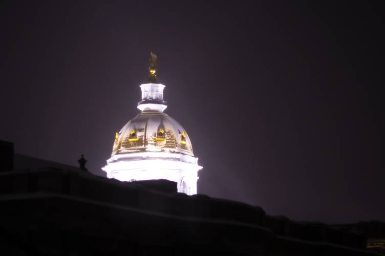 The State House dome is covered in snow from the latest storm just before dawn on Thursday, February 13. 2025. The State House dome is covered in snow from the latest storm just before dawn on Thursday, February 13. 2025.