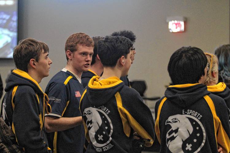 John Monroe (middle left), a Bow High alumnus, is a freshman on SNHU’s esports team and was at the state championship to help coach his brother, Carter, and the rest of the Falcons’ Super Smash Bros. team.