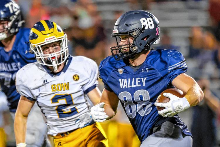 Merrimack Valley senior tight end Michael Heine (88) runs with the ball while Bow linebacker Caleb Schumacher (2) attempts to tackle. Both showed their talents with solid performances on both sides of the ball on Friday night. Bow won 23-13.
