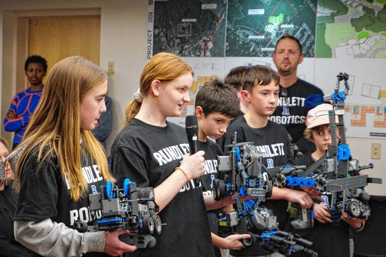 Members of the robotics club at Rundlett Middle School demonstrated their creations to the school board at the outset of its meeting Monday night. The group meets after school and worked to build their robots and code them to complete specific tasks. The club is run through the district's 21st Century Community Learning Centers afterschool program. 