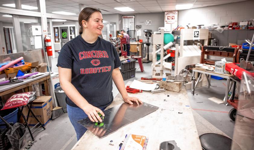 Concord High School senior Laura Lorenze works on making an updated bracket for the team robot on the CNC drill machine on Wednesday, February 26, 2025. The team has a competition match this Saturday.