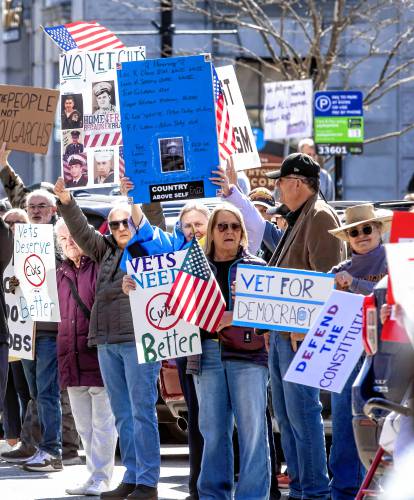 Protesters demanding better veteran coverage demonstrate outside the State House on Friday, March 14, 2025.