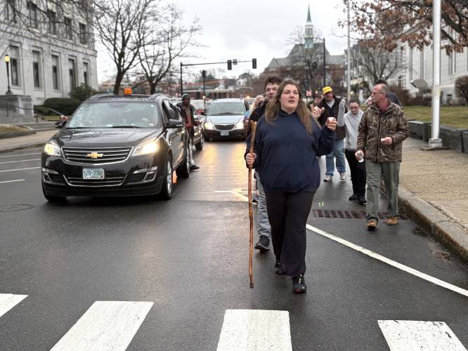 Jyanna Brideau, the niece of Rodney Moody, led the parade past the State House on Saturday, March 30, 2025. Moody passed away at the Concord Coalition to End Homelessness winter shelter on February 23rd. Following the service, a group walked in procession from CenterPoint Church on North State Street to the shelter in honor of Moody.