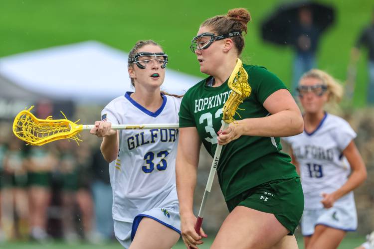 Senior captain Sydney Westover carries the ball up the field for the Hawks in Hopkinton’s semifinal loss to Gilford.