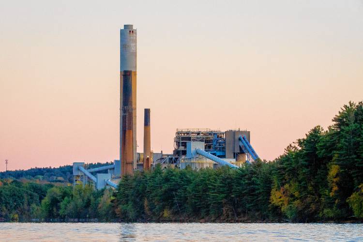 The Merrimack Station power plant in Bow is seen at dusk in 2017.