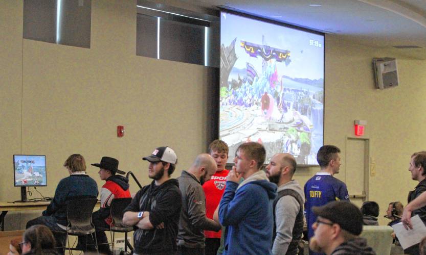 The Pembroke team watches as Graeme Haglund (L) masterfully uses Jigglypuff to beat Londonderry at the Super Smash Bros. State Championship.
