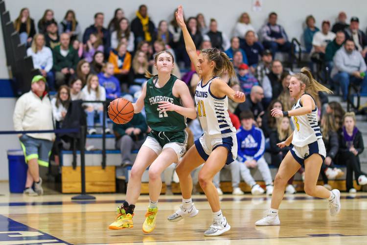 Pembroke junior Annelise Dexter fights for positioning against Bow senior Alex Larrabee in last year’s Division II quarterfinal on March 4. Dexter – an All-State First Team selection – is back to lead the Spartans again this season.