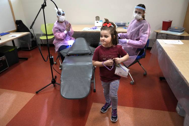 Amber Warner leaves the chair after a dental exam at the Christa McAuliffe School in Concord, N.H., Wednesday, Feb. 21, 2024. (AP Photo/Robert F. Bukaty) 