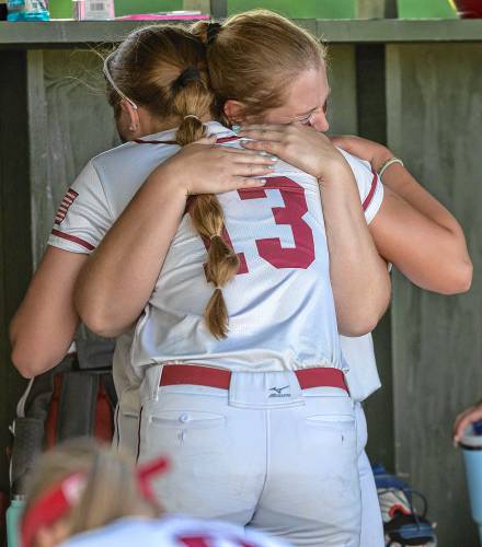 Maggie Taylor (13) hugs Maddy Wachter after Concord's season came to an unexpected end on Wednesday, May 29, 2024 following a 1-0 loss to Portsmouth in the first round of the playoffs.