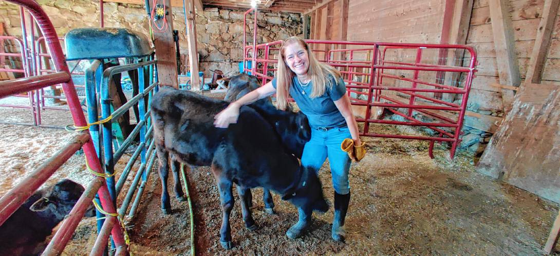 Cheryl Moran with one of the newest cows at Hilltop Farm.