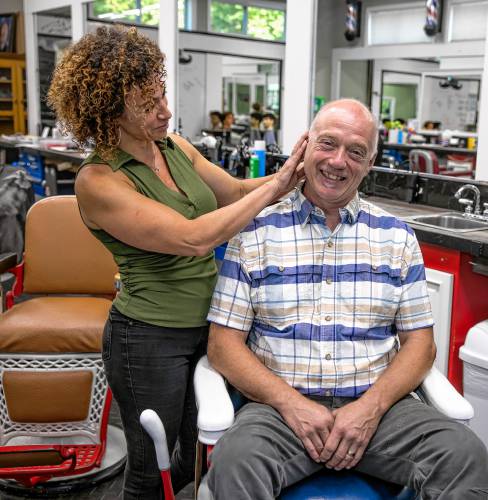 Cynthia Caron decided that David Caron needed a haircut at their New England School of Barbering in Penacook on August 28, 2024. The pair also own American Barber Studios in both Concord and Henniker.