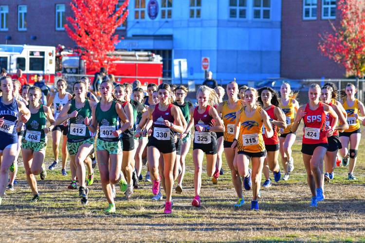 Concord’s Gianna Gualtieri (330) and Quinn Doherty (325), and Bow’s Hannah Pawlowski (315) take off from the starting line at the 47th Capital Area Cross Country Championship on Thursday at Merrimack Valley High School.