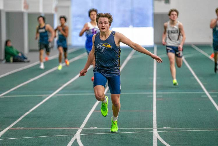 Bow’s Kody McCranie crosses the finish line to win the 300 meters at an indoor track meet on Saturday at Plymouth State.