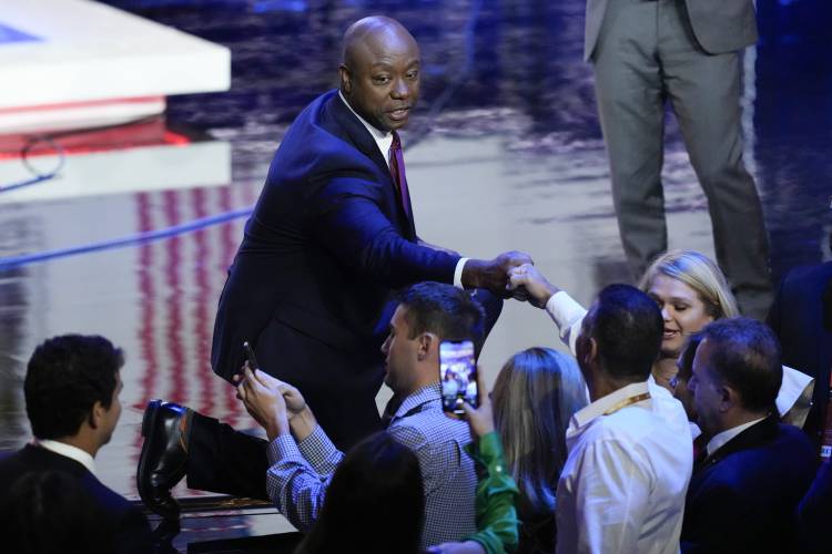 Republican presidential candidate Sen. Tim Scott, R-S.C., greets people after a Republican presidential primary debate hosted by NBC News, Wednesday, Nov. 8, 2023, at the Adrienne Arsht Center for the Performing Arts of Miami-Dade County in Miami. (AP Photo/Rebecca Blackwell)