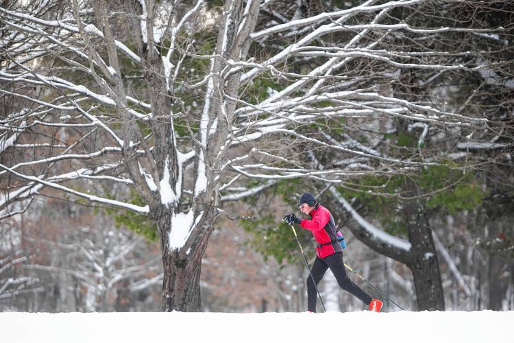 Former Concord High cross country coach and former city councilman Alan Hershlag enjoy the fresh snow on the Beaver Meadow cross country course on Monday morning, January 8, 2024.