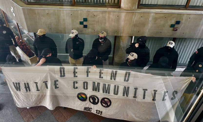 Members of NSC-131, a neo-Nazi group in New England, protest story hour outside Teatotaller cafe in downtown Concord. Members of NSC-131, a neo-Nazi group in New England, protest story hour outside Teatotaller cafe in downtown Concord.