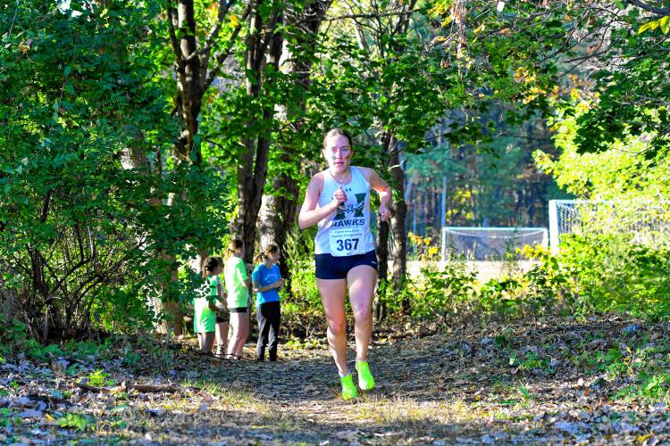 Hopkinton’s Maddy Lane takes an early lead in the first mile of the 47th Capital Area Cross Country Championship on Thursday at Merrimack Valley High School. Lane won the title in 18:38.
