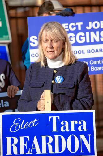 Tara Reardon, Democratic candidate for N.H. Senate District 15, holds a sign outside the Green Street Community Center, the Ward 5 polling location, in Concord Tuesday afternoon.