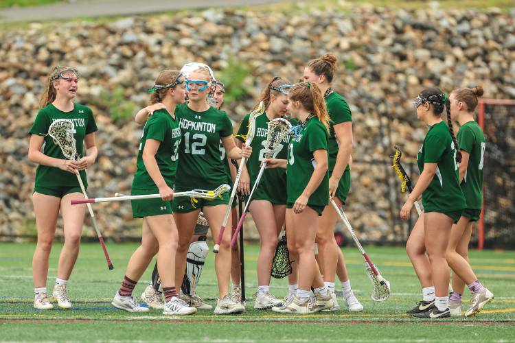 The third-seeded Hopkinton Hawks team is visibly upset after losing by a wide margin in the Division III state semifinal to Gilford, 18-2.