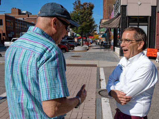 Mark Ciborowsky, a property owner in Downtown Concord, and David Dingman, a business owner, chat on Main Street on Tuesday afternoon, October 3, 2023. 