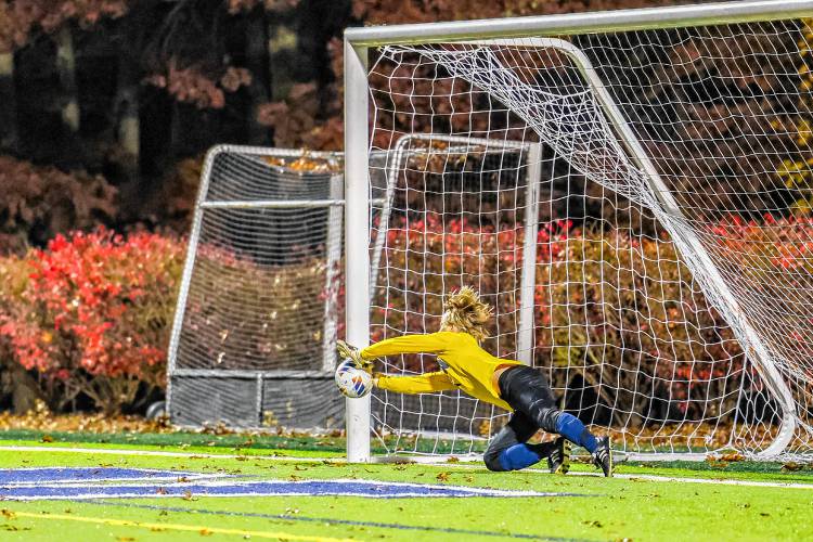 Bow goalie Aaron Barrieau makes the game-winning save during penalty kicks in the Division II boys’ soccer semifinal on Tuesday at Stellos Stadium in Nashua. The match was scoreless after 110 minutes, but Bow prevailed in the shootout, 3-1, to advance to the D-II championship.