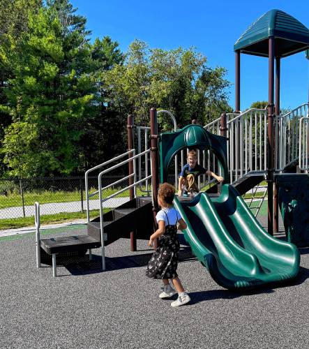 First grade students Charlotte and Jackson exploring the new playground.