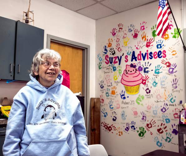 Suzie Seagroves stands in front of “Suzy’s wall” in the classroom where she teaches at Bishop Brady class on February 19, 2025.