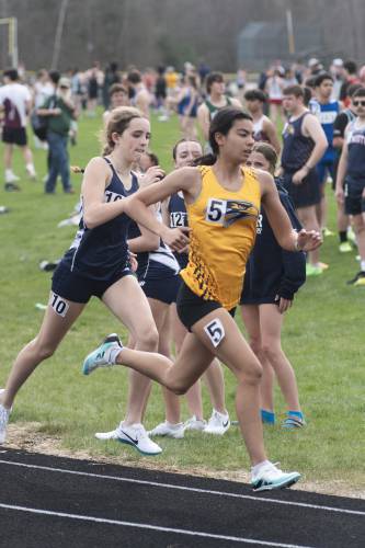 Bow's Julia Hou races in the 800 meters at the Sanborn Invitational at Sanborn Regional High School in Kingston on Saturday, April 19, 2025. Hou medaled in three events, finishing fourth in the 800 and clearing 9 feet, 7 inches to set the meet record in the pole vault. Hou also ran a leg on Bow's fourth-place 4x400-meter relay. DAVIO DELUCA / NHXCTF