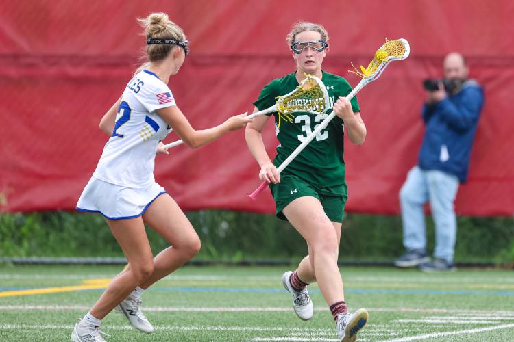 Hopkinton senior defender Ryan Lang (32) had her hands full against the Golden Eagles’ quick offense in the D-III semifinal.