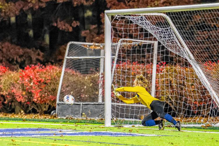 Bow goalie Aaron Barrieau makes the game-winning save during penalty kicks in the Division II boys' soccer semifinal on Tuesday at Stellos Stadium in Nashua. The match was scoreless after 110 minutes, but Bow prevailed in the shootout, 3-1, to advance to the D-II championship.