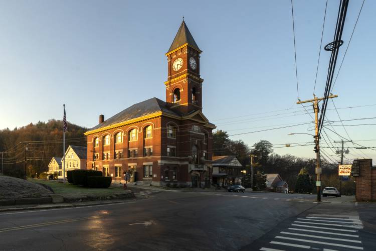 Town Hall catches the early morning sunlight, Thursday, Nov. 16, 2023, in Hinsdale, N.H. The small town in southwestern New Hampshire received a gift of $3.8 million from the estate of Geoffrey Holt, a longtime trailer park resident. (AP Photo/Robert F. Bukaty)