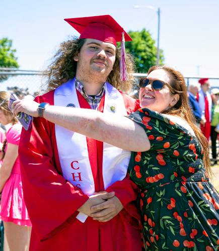 Jillian Fox gets a reluctant hug from her son, Alexavier Hildreth, after the Concord High School graduation at Memorial Field in Concord on Saturday, June 15, 2024.