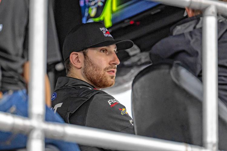 NASCAR Cup Series driver Kaz Grala sitting in his team’s pit road stand during a weather delay during Sunday’s race at New Hampshire Motor Speedway in Loudon. Grala is a Boston-area native who is trying to get a foothold in NASCAR’s top circuit.