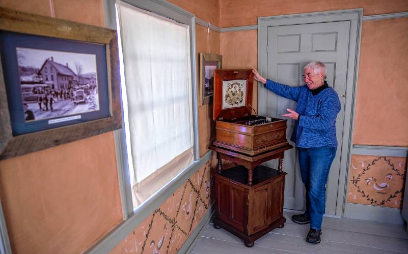 Hometown Hero Rebecca Courser shows off an early 19th century phonograph at the Upton Chandler House Museum in downtown Warner on Wednesday. The town of Warner just celebrated its 250th Birthday.