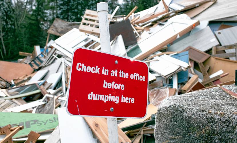 A sign in front of a building materials dumping area at the Hopkinton Webster Transfer Station in Hopkinton on Wednesday, January 3, 2024.