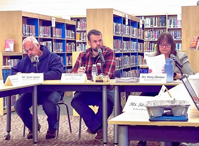 Pembroke School Board chair Andy Camidge (center) and Superintendent Patty Sherman (right) provide updates on cuts to the Pembroke school district Tuesday.