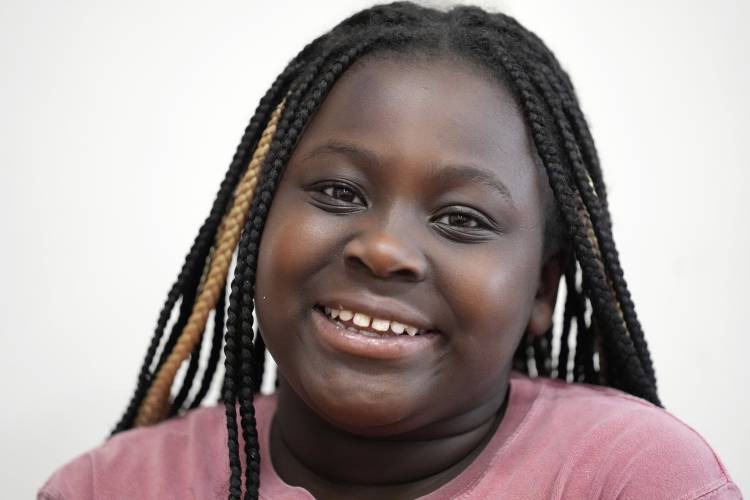 Evette Sesay smiles after a dental check-up at the Christa McAuliffe School in Concord.