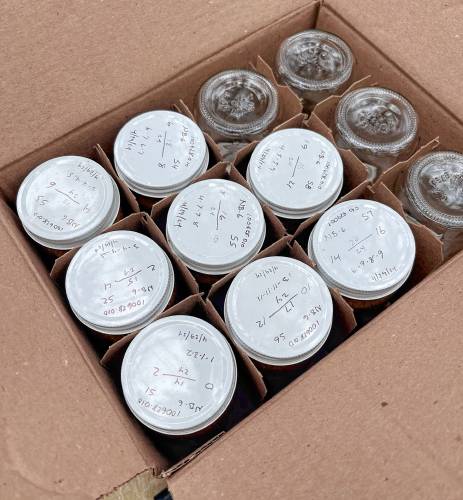 Some of the jars filled with soil samples from the middle school site near Broken Ground School.