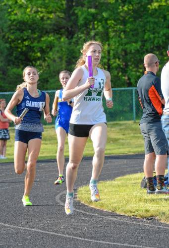 Hopkinton’s Reese Bove (3) runs a leg of the 4x800-meter relay at the NHIAA Division III track and field championship at Winnisquam Regional High School on Thursday. The Hawks won the 4x800 and the overall team title.