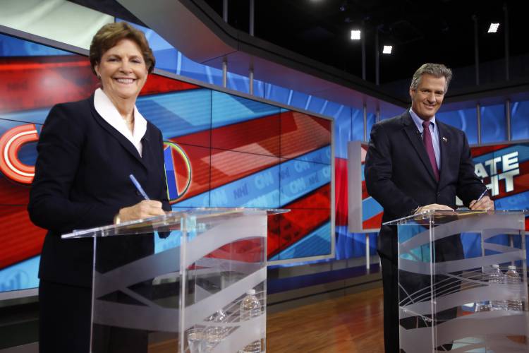 FILE - In this Oct. 23, 2014 file photo, Sen. Jeanne Shaheen, D-N.H., left, and former Massachusetts Sen. Scott Brown are seen before a live televised Senate debate hosted by the former NH1 News in Concord, N.H. (AP Photo/Jim Cole, File)