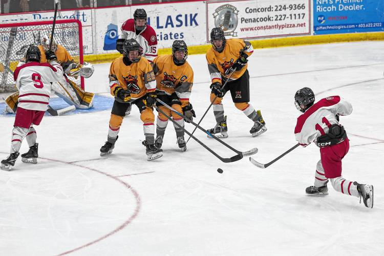 Lukas Rondiak (11) takes a shot into the top left corner to score Concord’s third goal against the Manchester Kings on Saturday.