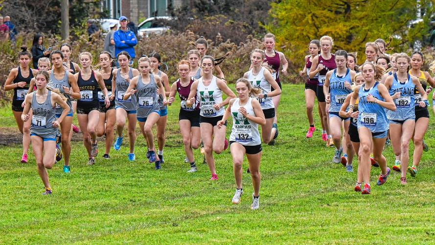 Hopkinton’s Maddy Lane (132) and Shaylee Murdough (133) take off from the starting line at the NHIAA Meet of Champions at Alvirne High School in Hudson on Saturday.