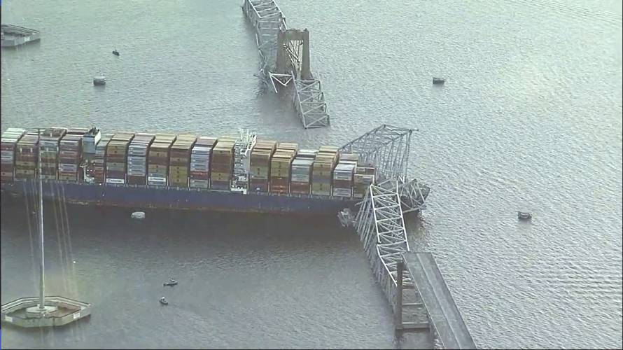 Parts of the Francis Scott Key Bridge remain after a container ship collided with one of the bridge’s supports Tuesday, March 26, 2024 in Baltimore. The major bridge in Baltimore snapped and collapsed after a container ship rammed into it early Tuesday, and several vehicles fell into the river below. Rescuers were searching for multiple people in the water. (WJLA via AP)