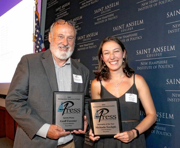 Reporter Michaela Towfighi and photo editor Geoff Forester pose with their awards for Journalist of the Year and Photographer of the Year at the annual New Hampshire Press Association awards. 