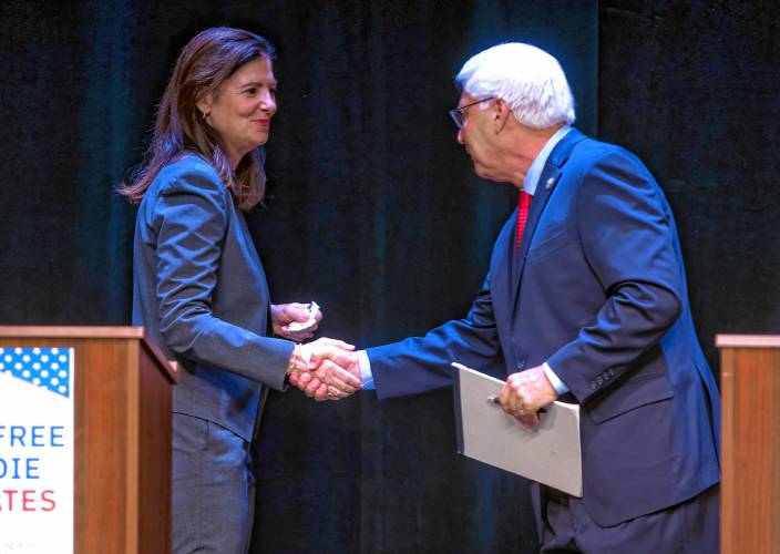 Republican gubernatorial candidates Kelly Ayotte and Chuck Morse shake hands at the end of their debate at the Rosamond Page Putnam Center for the Performing Arts at New England College in Henniker on Wednesday night.