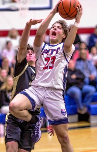 Pittsfield guard Brayden Pelletier goes up for a layup against Portsmouth Christian Academy on Tuesday.