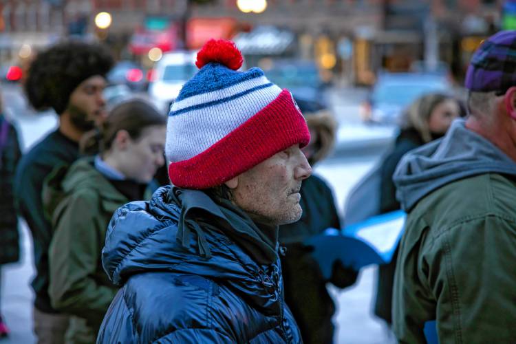 Larry Regan was one of the crowd gathered at City Plaza in front of the State House in honor of his wife and acknowledged his fight with homelessness on Thursday night, December 19, 2024. “I’m actually one of the lucky ones,” he said. “I made it out.”